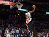 Jeremy Evans of the Utah Jazz jumps over a painting of himself in the final round during the Sprite Slam Dunk Contest part of 2013 NBA All-Star Weekend at the Toyota Center on February 16, 2013