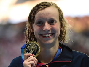 Ledecky eases to record-breaking gold