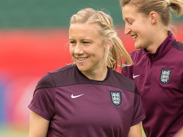 England's Laura Bassett (L) looks on with teammates during their final training session at the FIFA Women's World Cup in Edmonton, on July 3, 2015