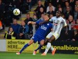 Dean Hammond of Leicester City is tackled by Kelvin Maynard of Burton Albion during the Pre Season Friendly match between Burton Albion and Leicester City at Pirelli Stadium on July 28, 2015
