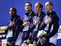 France's Mehdy Metella, Florent Manaudou, Fabien Gilot and Jeremy Stravius pose during the podium ceremony of the men's 4x100m freestyle relay swimming event at the 2015 FINA World Championships in Kazan on August 2, 2015