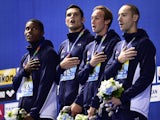 France's Mehdy Metella, Florent Manaudou, Fabien Gilot and Jeremy Stravius pose during the podium ceremony of the men's 4x100m freestyle relay swimming event at the 2015 FINA World Championships in Kazan on August 2, 2015