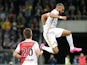 Layvin Kurzawa of AS Monaco (R) celebrates after scoring his team's opening goal during the UEFA Champions League third qualifying round 1st leg match between BSC Young Boys and AS Monaco at Stade de Suisse on July 28, 2015