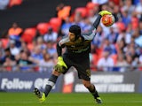 Arsenal's Czech goalkeeper Petr Cech rolls the ball out during the FA Community Shield football match between Arsenal and Chelsea at Wembley Stadium in north London on August 2, 2015