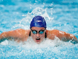 Kelly wins swim-off to reach semi-finals