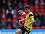 Sam Winnall of Barnsley holds off Derrick Williams of Bristol City during the Sky Bet League One match between Bristol City and Barnsley at Ashton Gate on March 28, 2015