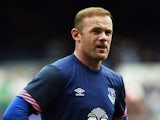 Manchester United's former Everton forward Wayne Rooney warms up ahead of the Duncan Ferguson Testimonal pre-season friendly football match between Everton and Villarreal at Goodison Park in Liverpool, north west England on August 2, 2015