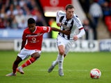 Callum McManaman of West Brom holds off Rico Henry of Walsall during the Pre-Season Friendly between Walsall and West Bromwich Albion at Banks' Stadium on July 28, 2015