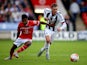 Callum McManaman of West Brom holds off Rico Henry of Walsall during the Pre-Season Friendly between Walsall and West Bromwich Albion at Banks' Stadium on July 28, 2015
