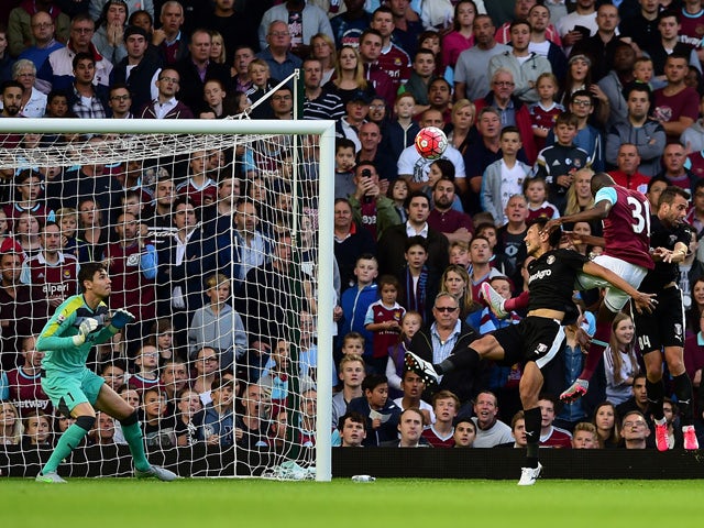 Enner Valencia of West Ham (3R) scores his side's opening goal during the UEFA Europa League third qualifying round match between West Ham United and Astra Giurgiu at the Boleyn Ground on July 30, 2015