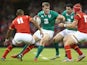 Andrew Trimble of Ireland takes on Tyler Morgan and Eli Walker (L) during the International match between Wales and Ireland at the Millennium Stadium on August 8, 2015