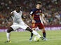 AS Roma's French defender Mapou Yanga-Mbiwa (L) vies with Barcelona's Argentinian forward Lionel Messi (R) during the 50th Joan Gamper Trophy football match FC Barcelona vs AS Roma at the Camp Nou stadium in Barcelona on August 5, 20
