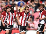 James Tarkowski (2nd R) of Brentford celebrates scoring his side's second goal during the Sky Bet Championship match between Brentford and Ipswich Town at Griffin Park on August 8, 2015
