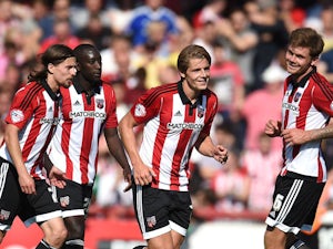 James Tarkowski (2nd R) of Brentford celebrates scoring his side's second goal during the Sky Bet Championship match between Brentford and Ipswich Town at Griffin Park on August 8, 2015