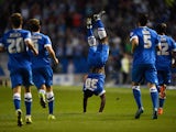 Kazenga LuaLua of Brighton celebrates after scoring the first goal of the season during the Sky Bet Championship match between Brighton & Hove Albion and Nottingham Forest at Amex Stadium on August 7, 2015