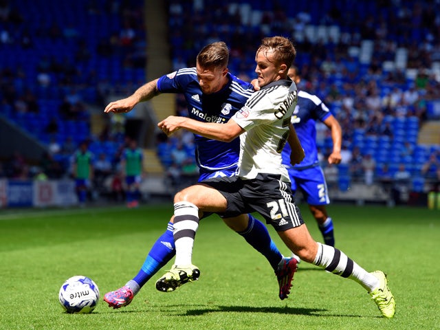 Fulham defender Lasse Vigen Christensen challenges Cardiff striker Anthony Pilkington during the Sky Bet Championship match between Cardiff City and Fulham at Cardiff City Stadium on August 8, 2015 