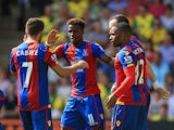 Wilfried Zaha of Crystal Palace celebrates scoring his team's first goal with his team mate during the Barclays Premier League match between Norwich City and Crystal Palace at Carrow Road on August 8, 2015 