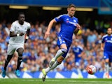 Gary Cahill of Chelsea breaks with the ball during the Barclays Premier League match between Chelsea and Swansea City at Stamford Bridge on August 8, 2015 