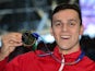 A happy James Guy poses with his gold medal after winning the men's 200m freestyle at the World Aquatics Championships on August 4, 2015