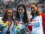 Bronze medalists Jessica Vall (L) of Spain, Rikke Moller Pedersen (R) of Denmark and Jinglin Shi (C) of China pose during the medal ceremony for the Women's 200m Breaststroke on day fourteen of the 16th FINA World Championships at the Kazan Arena on Augus