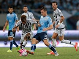 Kingsley Coman of Juventus FC contests the ball against Miroslav Klose of Lazio during the Italian Super Cup final football match between Juventus and Lazio at Shanghai Stadium on August 8, 2015
