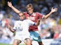 Giuseppe Bellusci (L) of Leeds United challenges Jelle Vossen of Burnley during the Sky Bet Championship match between Leeds United and Burnley at Elland Road on August 8, 2015