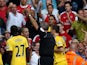 Referee Martin Atkinson shows a red card to Joe Cole of Liverpool during the Barclays Premier League match between Liverpool and Arsenal at Anfield on August 15, 2010