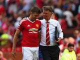 Michael Carrick of Manchester United walks with Louis van Gaal Manager of Manchester United after the Barclays Premier League match between Manchester United and Tottenham Hotspur at Old Trafford on August 8, 2015