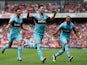 Mauro Zarate of West Ham United (C) celebrates with team mates as he scores their second goal during the Barclays Premier League match between Arsenal and West Ham United at the Emirates Stadium on August 9, 2015