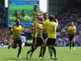 Miguel Layun (3rd L) of Watford celebrates scoring his team's first goal with his team mates during the Barclays Premier League match between Everton and Watford at Goodison Park on August 8, 201