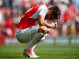 Olivier Giroud of Arsenal looks dejected after defeat during the Barclays Premier League match between Arsenal and West Ham United at the Emirates Stadium on August 9, 2015