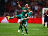 Christopher Dibon and Mario Sonnleitner of Rapid Wien celebrate after victory in the third qualifying round 2nd leg UEFA Champions League match between Ajax Amsterdam and SK Rapid Vienna held at Amsterdam ArenA on August 4, 2015