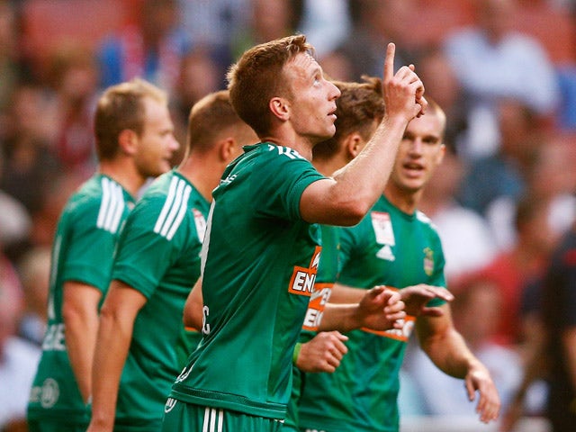 Robert Beric of Rapid Wien celebrates scoring his teams first goal of the game during the third qualifying round 2nd leg UEFA Champions League match between Ajax Amsterdam and SK Rapid Vienna held at Amsterdam ArenA on August 4, 2015