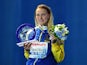Sweden's Sarah Sjostrom poses with her world record award during the podium ceremony for the women's 100m butterfly swimming event at the 2015 FINA World Championships in Kazan on August 3, 2015