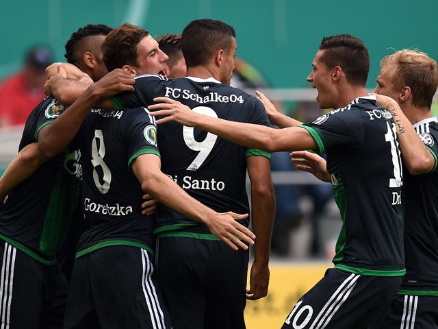 :Schalke´s players celebrate during the German Cup DFB Pokal first round football match between MSV Duisburg and Schalke 04 in Duisburg, western Germany on August 8, 2015.