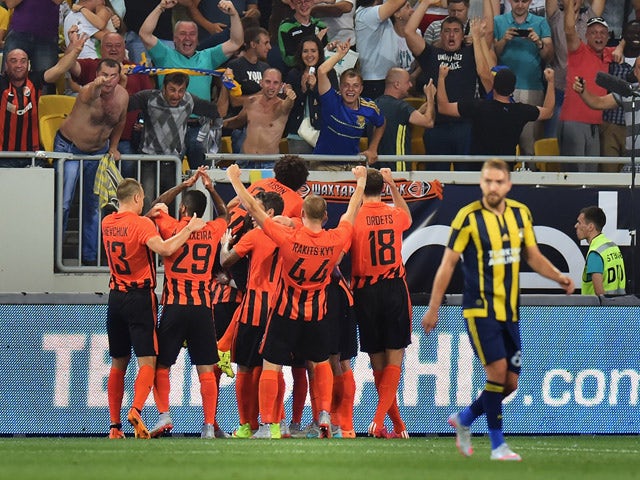 Shakhtar's players celebrate scoring a goal during the UEFA Champions League third qualifying round football match between FC Shakhtar Donetsk and Fenerbahce SC in Lviv on August 5, 2015