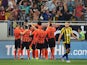 Shakhtar's players celebrate scoring a goal during the UEFA Champions League third qualifying round football match between FC Shakhtar Donetsk and Fenerbahce SC in Lviv on August 5, 2015