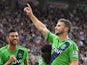 Shane Long of Southampton (7) celebrates with Victor Wanyama (12) and Graziano Pelle (L) as he scores their second goal during the Barclays Premier League match between Newcastle United and Southampton at St James' Park on August 9, 2015