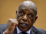Former South African Human Settlements Minister and businessman Tokyo Sexwale gestures on October 7, 2013