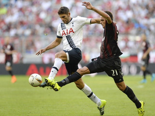 Tottenham's Argentinian defender Federico Fazio and Milan's midfielder Allesandro Matri vie the ball during the Audi Cup football match for third place Tottenham Hotspur vs AC Milan in Munich, southern Germany, on August 5, 2015