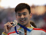 Gold medalist Zetao Ning of China poses during the medal ceremony for the Men's 100m Freestyle on day thirteen of the 16th FINA World Championships at the Kazan Arena on August 6, 2015