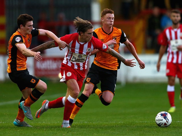 Josh Windass of Accrington Stanley in action with Andy Robertson and Sam Clucas of Hull City during the Capital One Cup First Round match between Accrington Stanley and Hull City at Wham Stadium on August 11, 2015