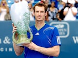Andy Murray of Great Britain poses with the winner's trophy after defeating Novak Djokovic of Serbia during the final of the Western & Southern Open at the Lindner Family Tennis Center on August 21, 2011