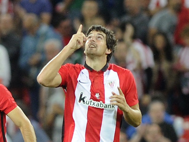 Athletic Bilbao's defender Mikel San Jose celebrates after scoring during the Spanish Supercup first-leg football match Athletic Club Bilbao vs FC Barcelona at the San Mames stadium in Bilbao on August 14, 2015