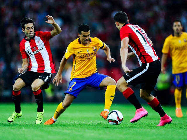 Pedro Rodriguez of FC Barcelona competes for the ball with Markel Susaeta (L) and Oscar de Marcos of Athletic Club during the Spanish Super Cup first leg match between FC Barcelona and Athletic Club at San Mames Stadium on August 14, 2015