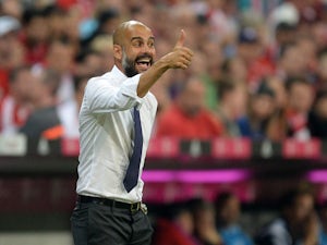Bayern Munich's Spanish headcoach Pep Guardiola reacts during the German first division Bundesliga football match FC Bayern Munich vs Hamburger SV at the Allianz Arena in Munich, southern Germany, on August 14, 2015