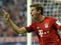 Bayern Munich's midfielder Thomas Muller celebrates scoring the 3-0 goal during the German first division Bundesliga football match FC Bayern Munich vs Hamburger SV at the Allianz Arena in Munich, southern Germany, on August 14, 2015