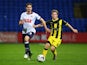 Dorian Dervite of Bolton Wanderers and Matt Palmer of Burton Albion watch the ball during the Capital One Cup first round match between Bolton Wanderers and Burton Albion at Macron Stadium on August 11, 2015 