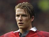 28 Mar 1998: David Beckham of Manchester United stands with his arms outstretched during an FA Carling Premiership match against Wimbledon