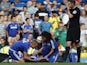 Chelsea doctor Eva Carneiro and head physio Jon Fearn treat Chelsea's Belgian midfielder Eden Hazard late on next to referee Michael Oliver during the English Premier League football match between Chelsea and Swansea City at Stamford Bridge in London on A